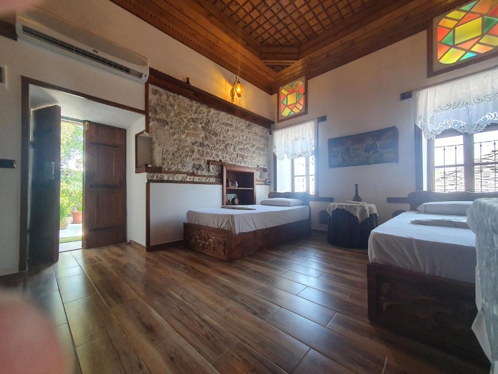 Ένα ή περισσότερα κρεβάτια σε δωμάτιο στο RIVA Guest House