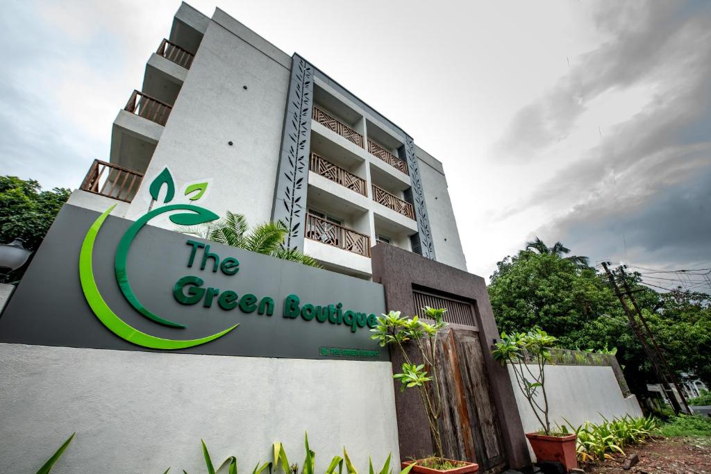 a building with a sign for the green boutique at The Green Boutique in Panaji