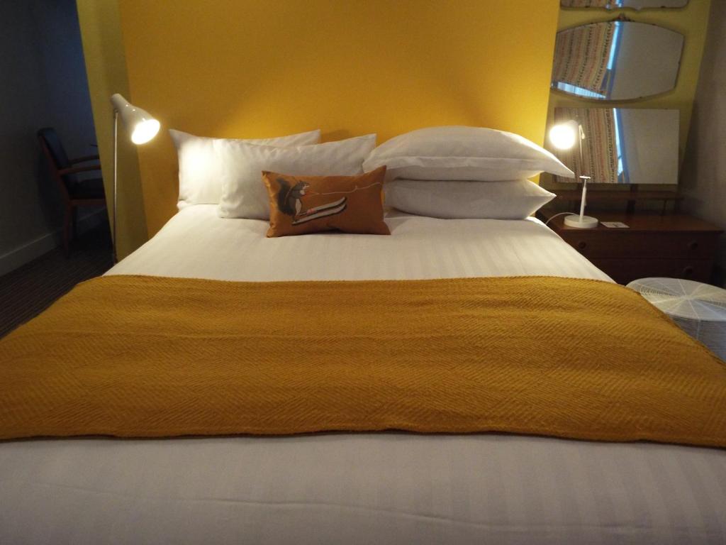 Cama ou camas em um quarto em Regency Rooms