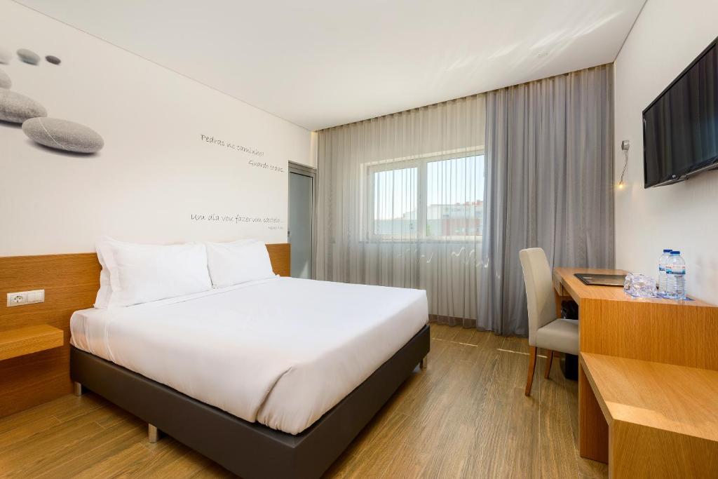 Posteľ alebo postele v izbe v ubytovaní TRYP by Wyndham Leiria