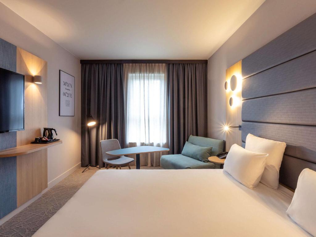 Voodi või voodid majutusasutuse Novotel Brussels Centre Midi toas