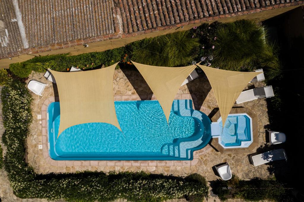 The swimming pool at or close to Aquae Sinis Albergo Diffuso