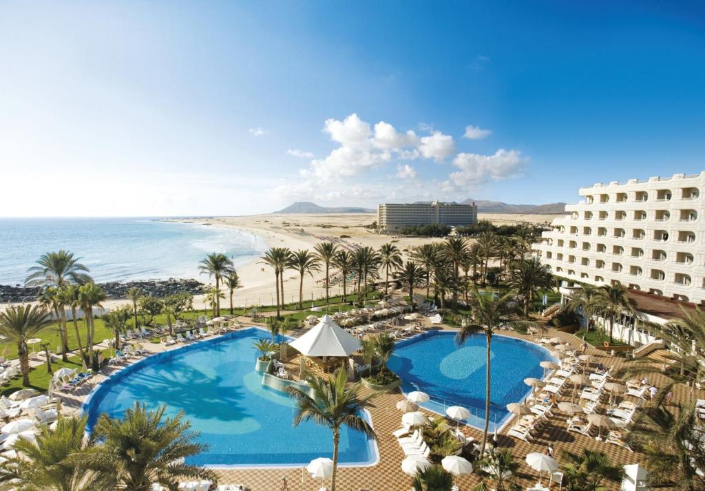 an aerial view of the hotel and the beach at Hotel Riu Palace Tres Islas in Corralejo