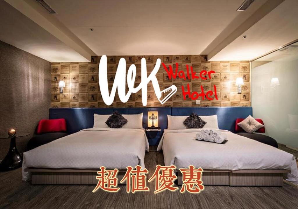 En eller flere senger på et rom på Walker Hotel - Zhengyi