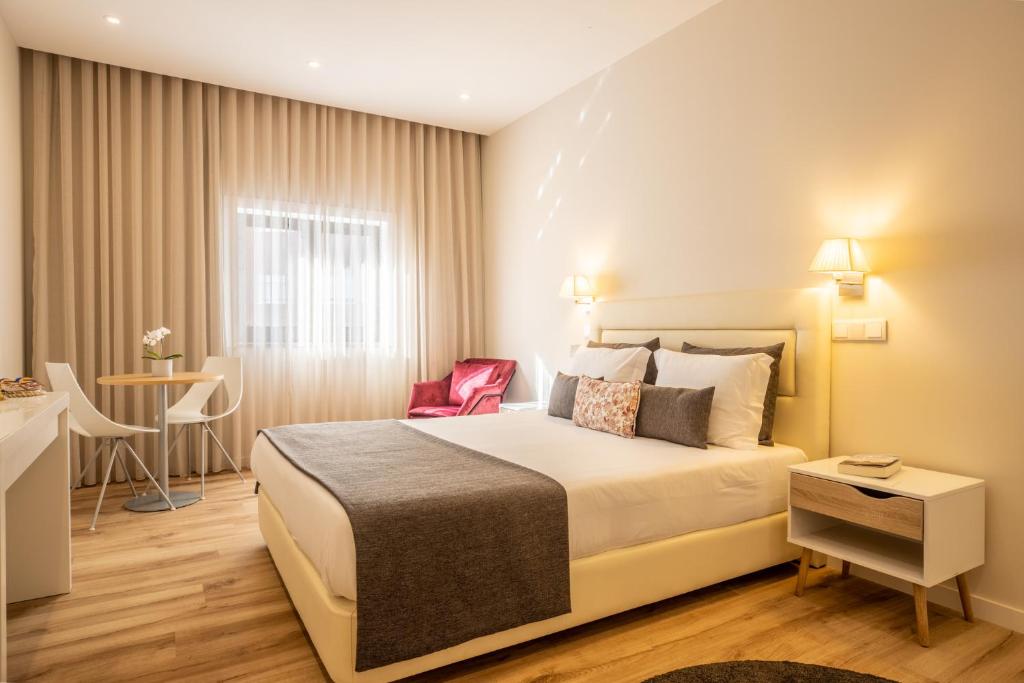 A bed or beds in a room at MyStay Matosinhos Centro