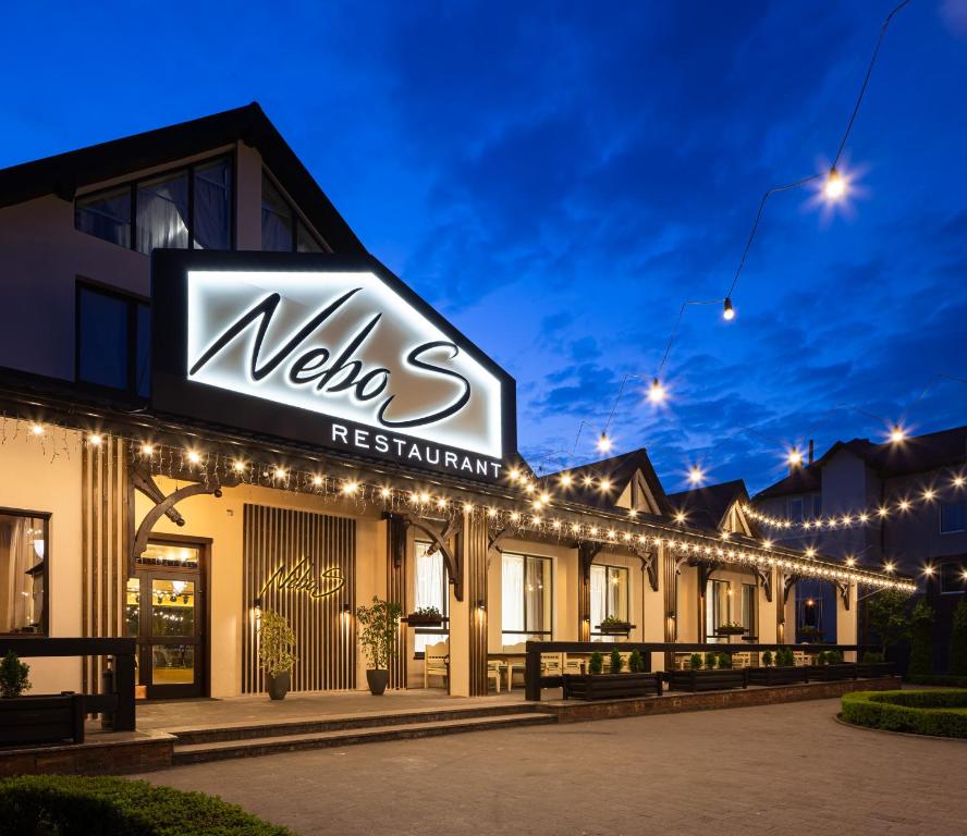 a building with a sign that reads welcome restaurant at NeboS Hotel & Restaurant in Ivano-Frankivsʼk