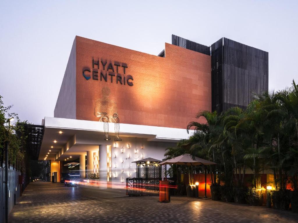 a building with a sign on the side of it at Hyatt Centric Candolim Goa in Calangute