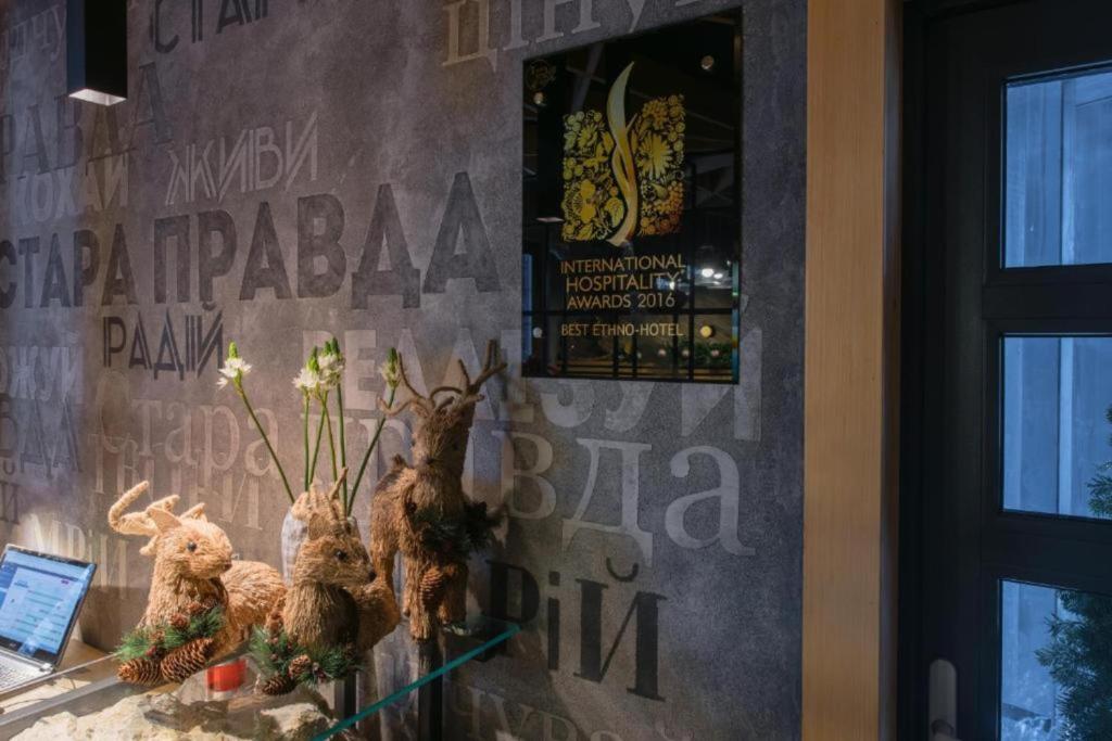 a group of stuffed animals sitting on a window sill at Stara Pravda Villas in Bukovel