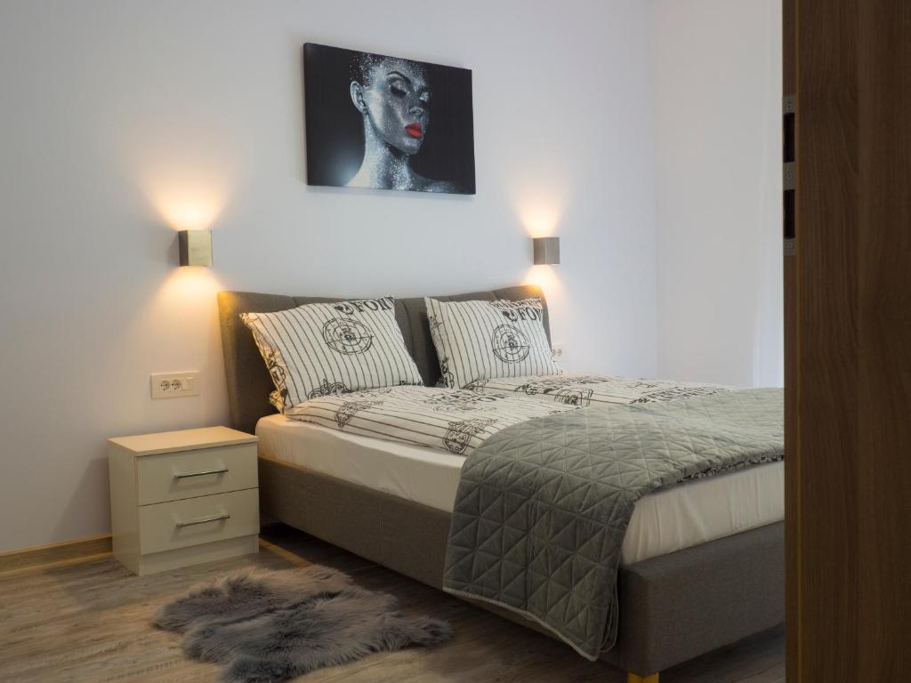 Cama ou camas em um quarto em Armony Apartament Timisoara