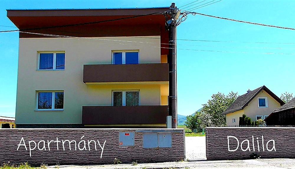 a building with a sign in front of it at Apartmány Dalila in Rajecké Teplice