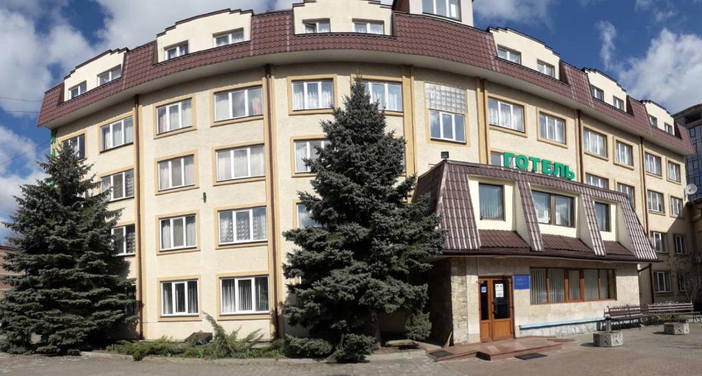 a large building with trees in front of it at Prykarpattya in Ivano-Frankivsʼk