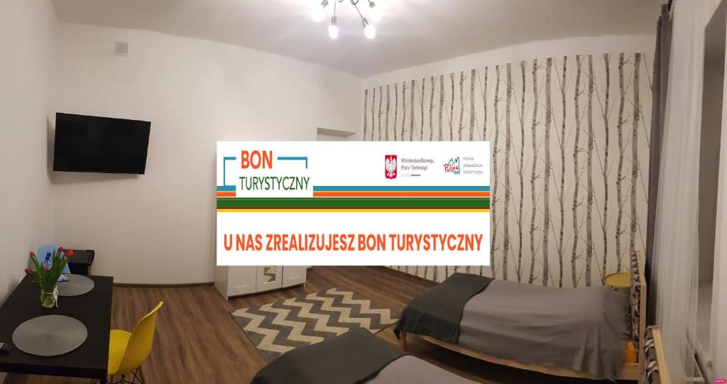 Un televizor și/sau centru de divertisment la Guest Room RÓWNA