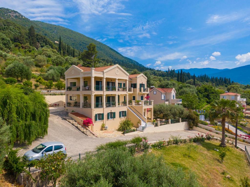 an aerial view of a house with a car parked in the driveway at Maria's Apartments in Sami