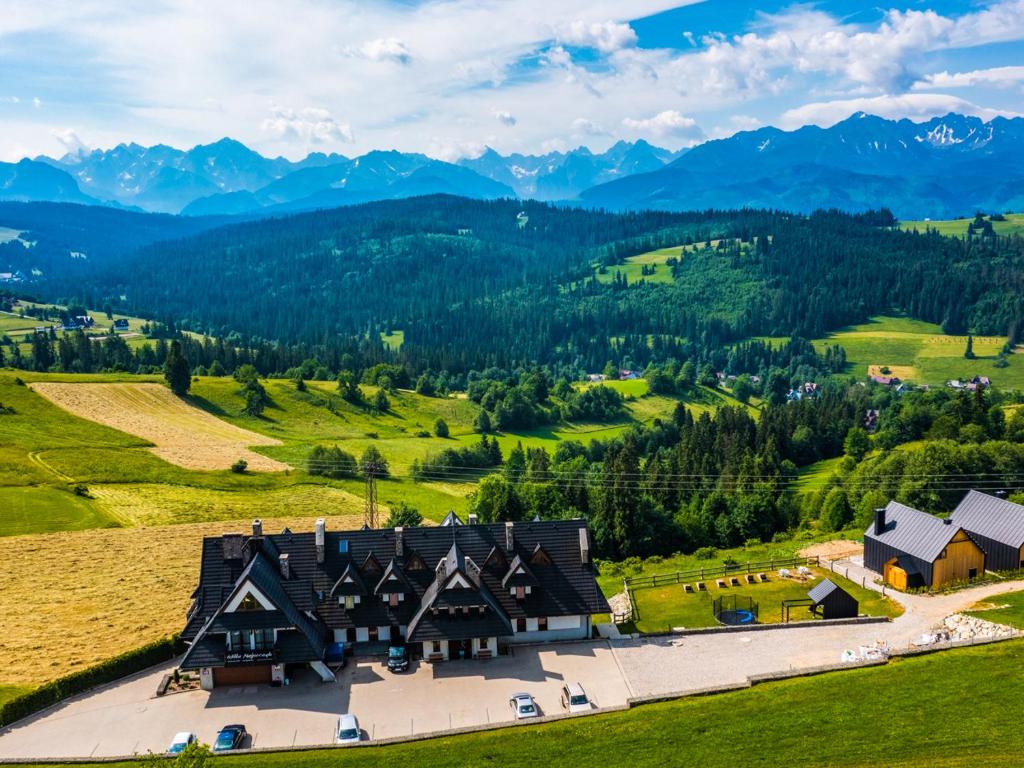 an aerial view of a house in the mountains at Willa Majerczyk in Poronin