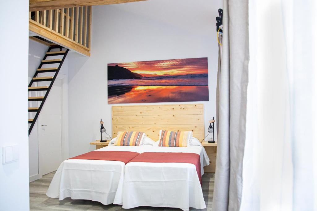 Cama ou camas em um quarto em Hotel La Caracola Suances