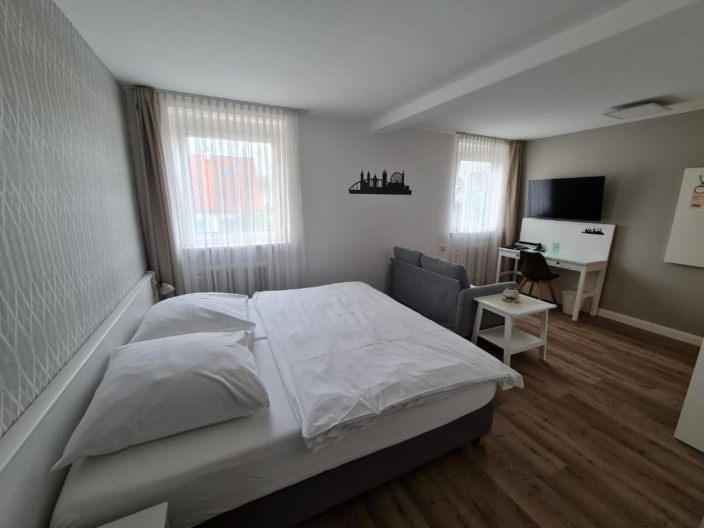 Ліжко або ліжка в номері City Hotel Franziska