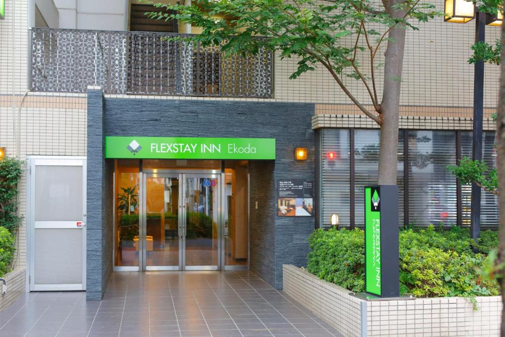 a building with a sign that reads freshkin min lobby at FLEXSTAY INN Ekoda in Tokyo