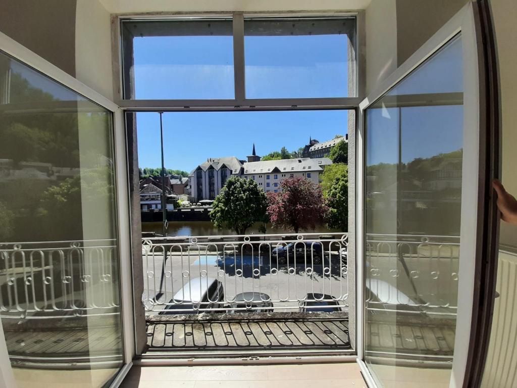 a view from a window of a balcony at Au bord de l'Ourthe in La Roche-en-Ardenne