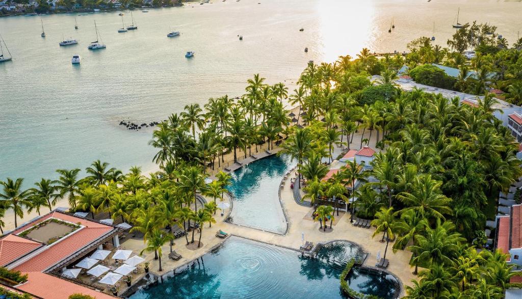 an aerial view of a resort with a beach at Mauricia Beachcomber Resort & Spa in Grand Baie