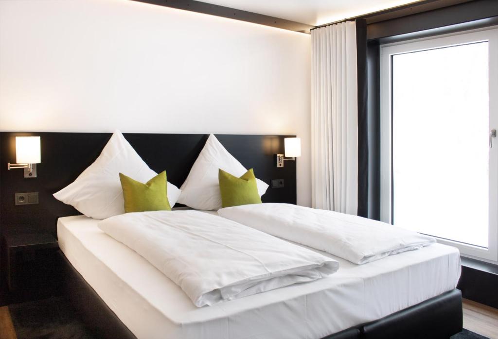 A bed or beds in a room at TO Hotel by WMM Hotels