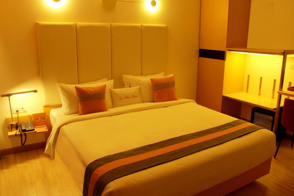 A bed or beds in a room at Zone Connect by The Park Coimbatore