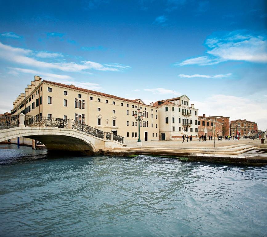 a bridge over a river in a city with buildings at Ca'di Dio-Small Luxury Hotel in Venice