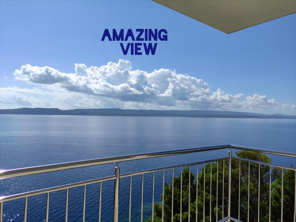 a view of the water from the balcony of an amazing view at Villa Orada in Brela