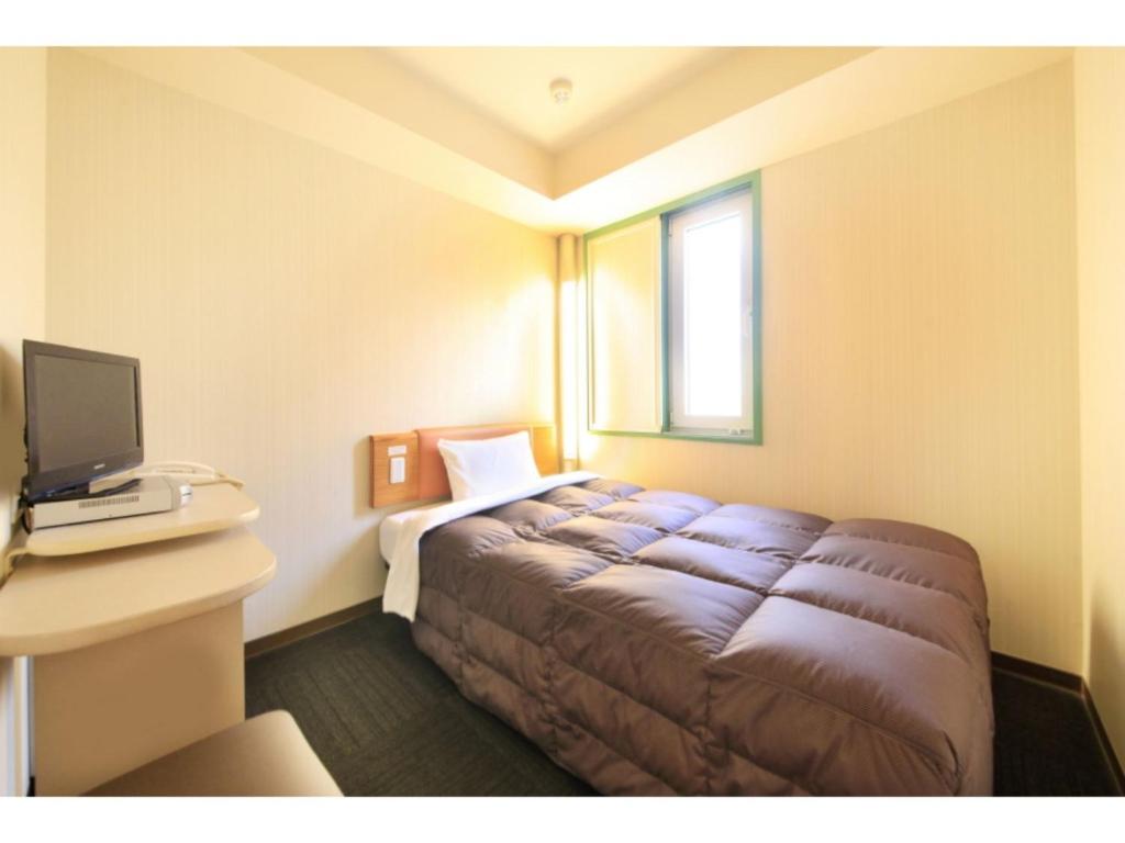 เตียงในห้องที่ R&B Hotel Sendai Hirosedori Ekimae - Vacation STAY 39659v