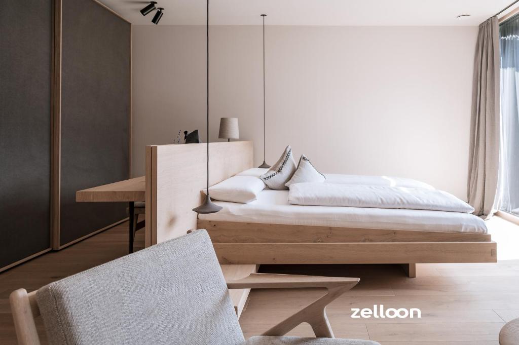 Llit o llits en una habitació de zelloon boutique hotel