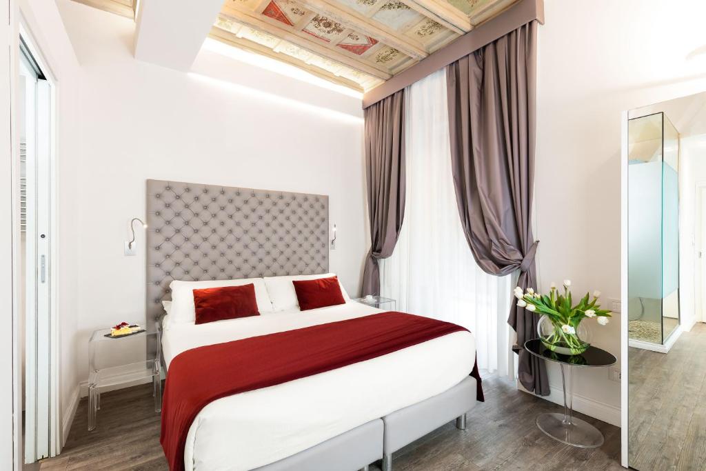 A bed or beds in a room at Hotel Navona