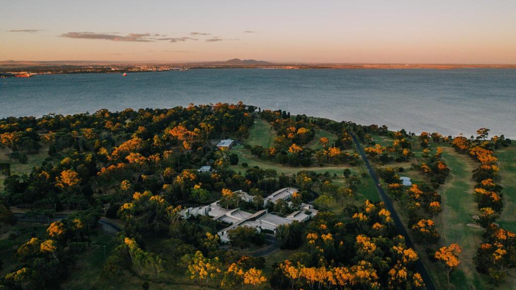 an aerial view of a house on an island in the water at Eden Oak Geelong in Geelong