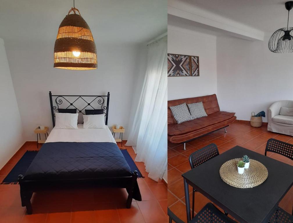 um quarto com uma cama e uma sala de estar em Porta Reguengos - Apartamento moderno Alentejo central em Reguengos de Monsaraz