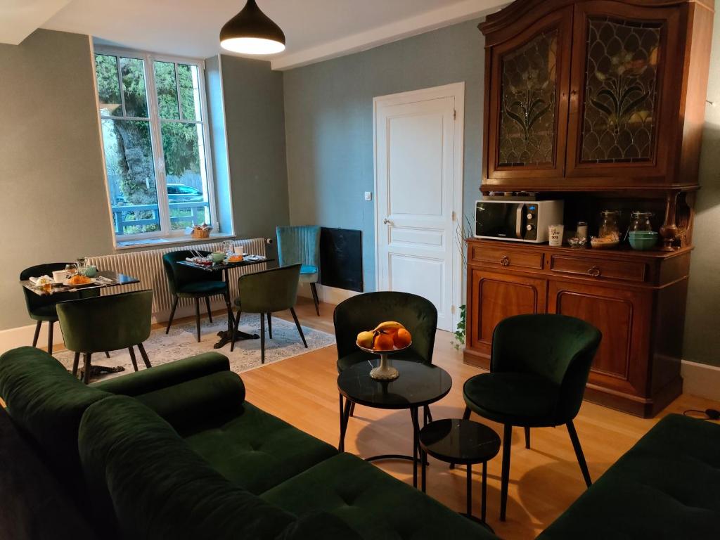 a living room with a couch and chairs and a table at Clos Terre-lune in Nuits-Saint-Georges