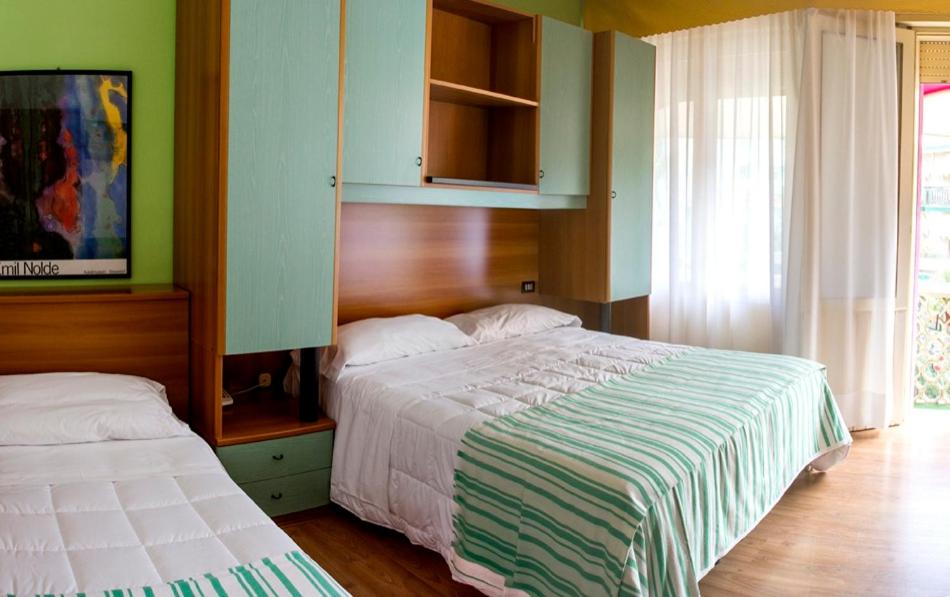 Una cama o camas en una habitación de Hotel Villa Roma