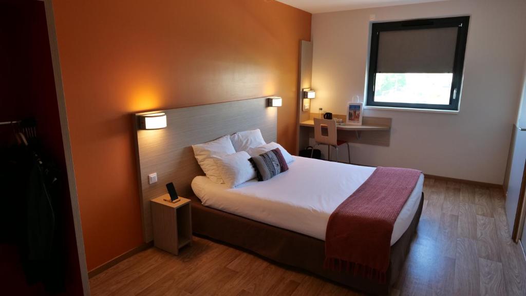 Cama ou camas em um quarto em Oneloft Hotel