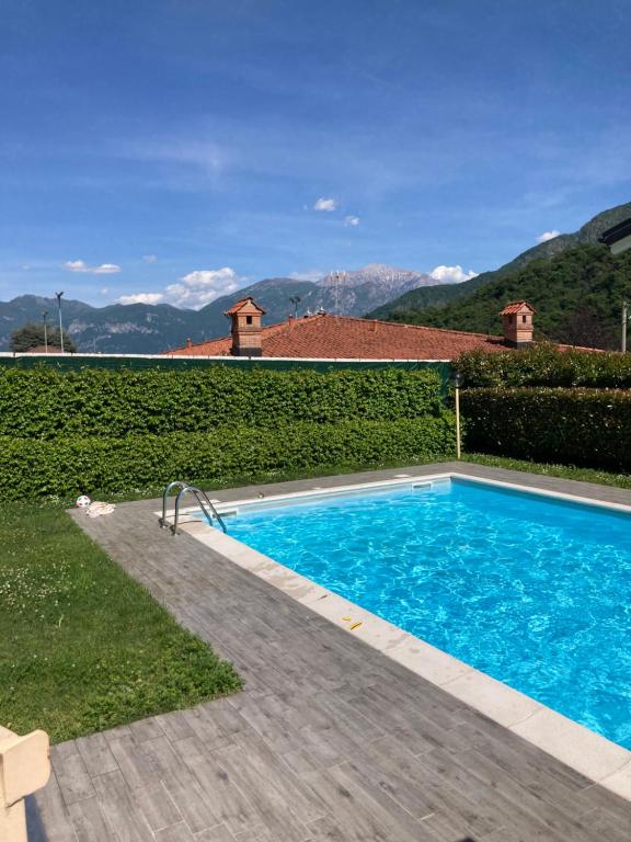 a swimming pool in the backyard of a house at Casa Lisa in Lenno