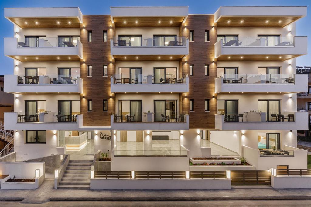 an apartment building with lights on the facade at Anassa Suites in Leptokaria