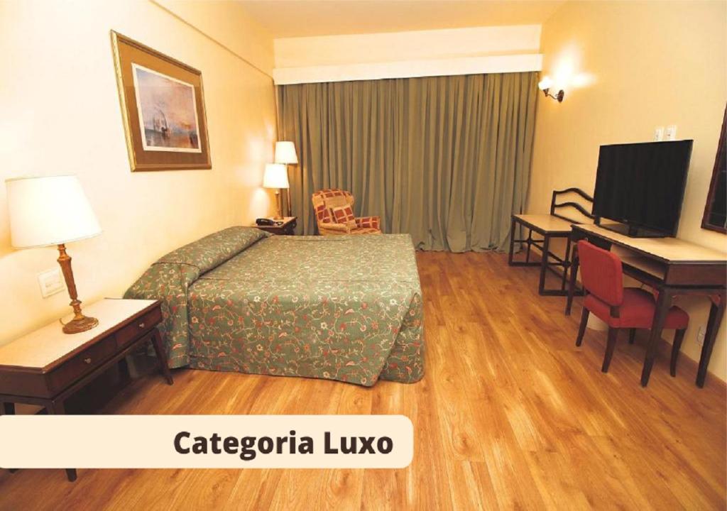 Cama ou camas em um quarto em Dayrell Hotel e Centro De Convenções