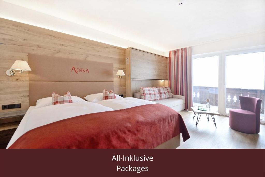 Giường trong phòng chung tại Hotel Alpina Superior