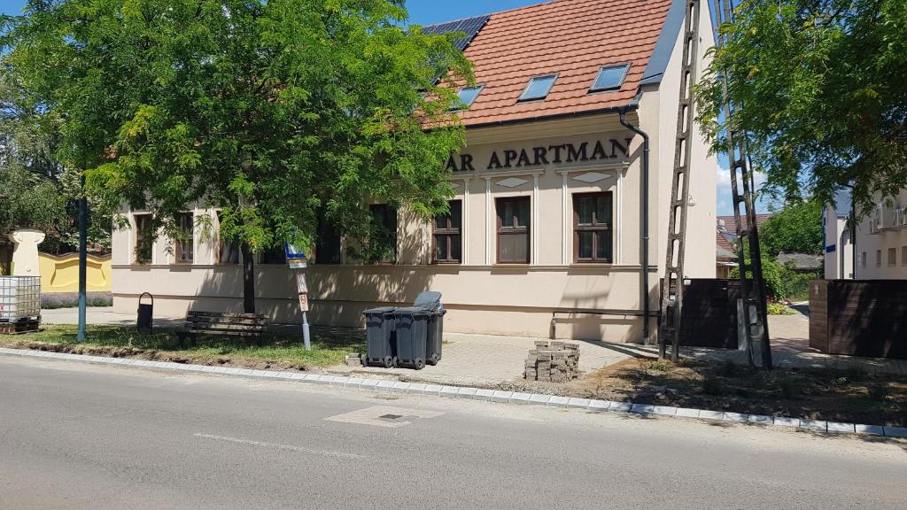 a building on the side of a street at Végvár Delux apartman in Gyula