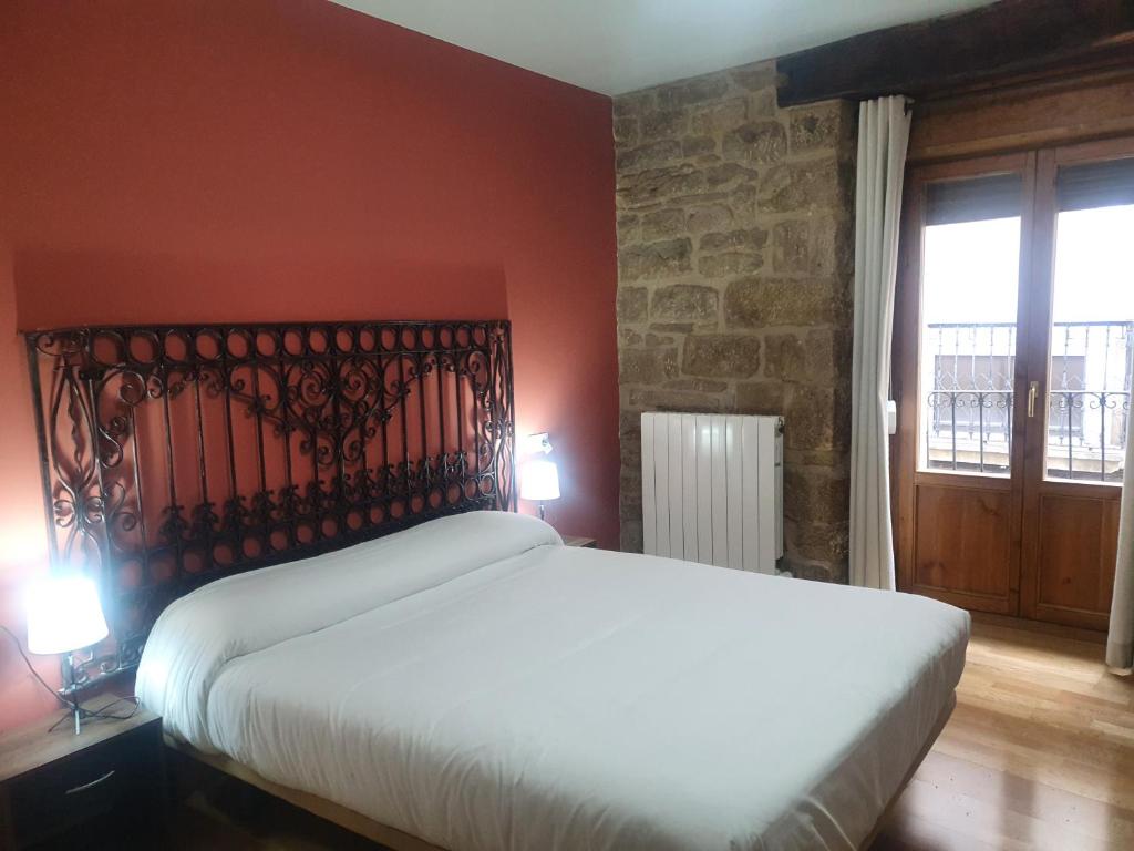 Posteľ alebo postele v izbe v ubytovaní Hostal Rural 18 de Abril