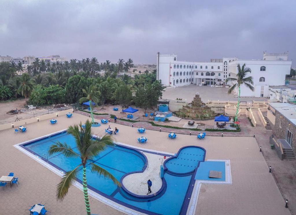 an aerial view of a resort with a swimming pool at Al Jabal Hotel in Salalah