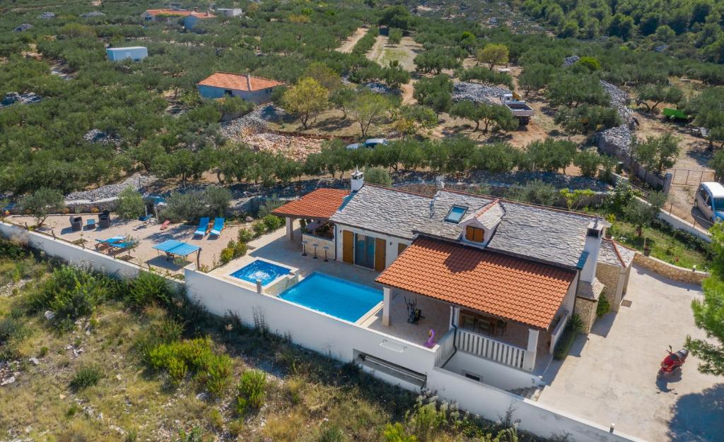 an aerial view of a house with a swimming pool at Villa Anabella in Supetar