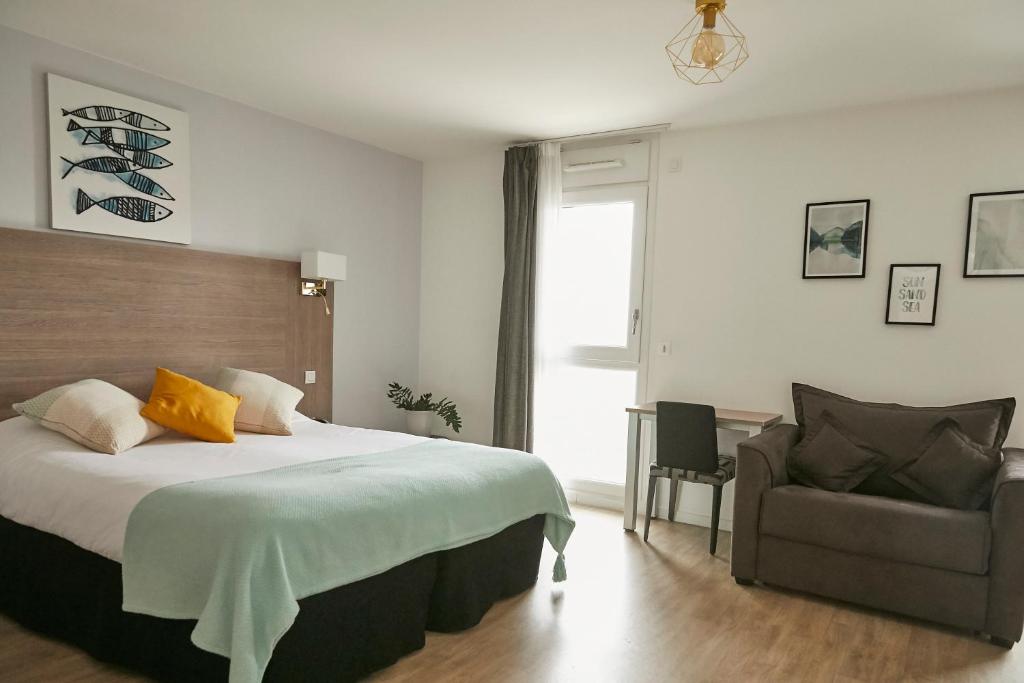 Cama ou camas em um quarto em Tulip Inn Massy Palaiseau - Residence