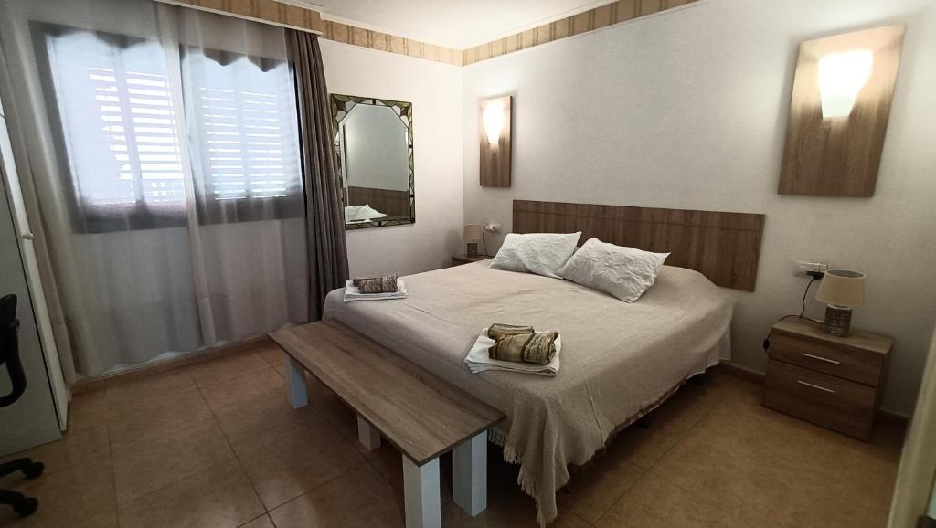 Tempat tidur dalam kamar di Casa Isabel, the perfect home for your holidays in Corralejo