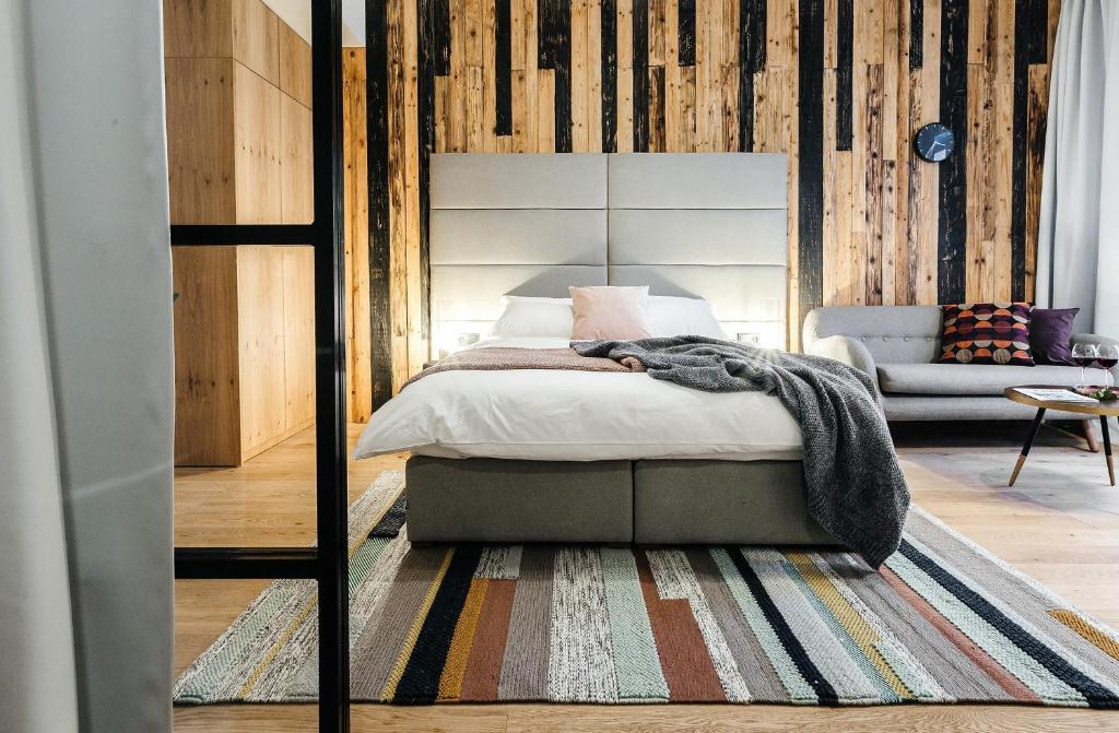 Una cama o camas en una habitación de Ski&Sun Apartamenty