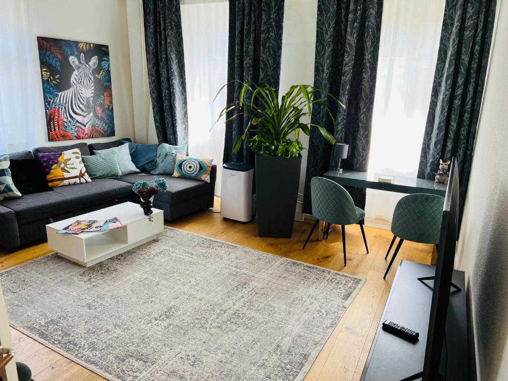 A seating area at Stylish two-floor apartment in a heart of Basel