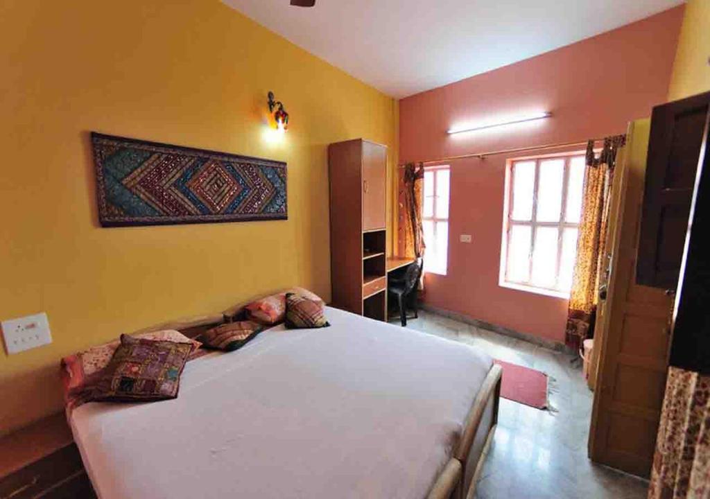 Krevet ili kreveti u jedinici u okviru objekta Ganpati Guest House