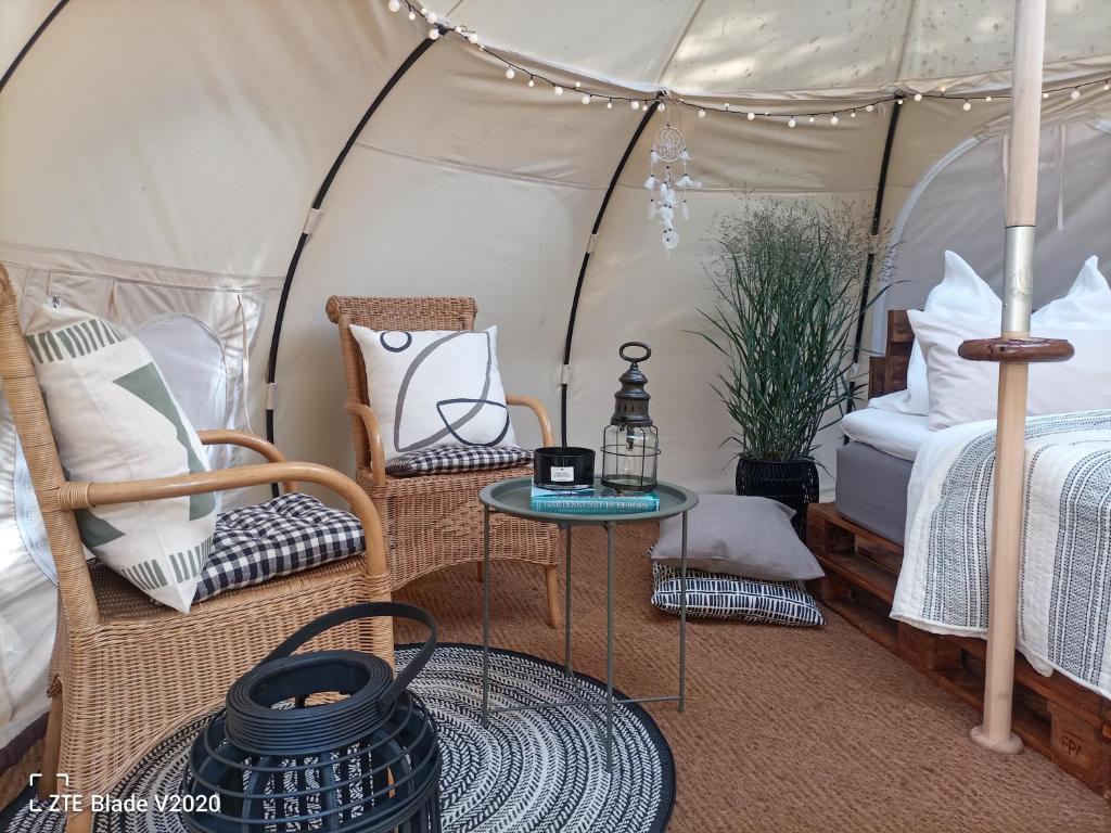 A bed or beds in a room at Glamping Altes Pastorat