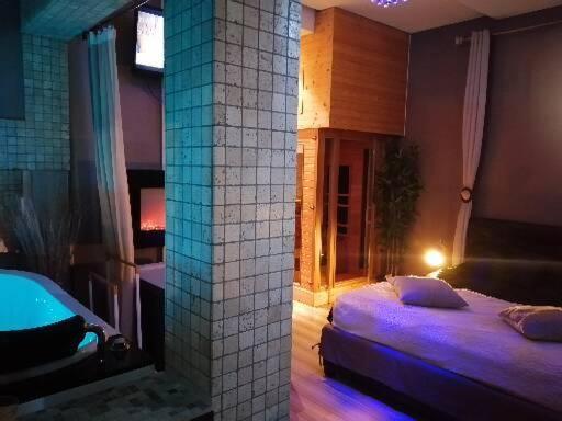 Ліжко або ліжка в номері L' Apparte Spa